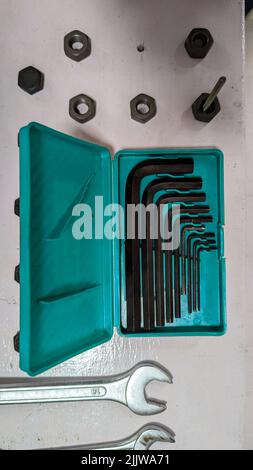 allen key wrench set in a green tool box used on bolts and nuts in workshops Stock Photo