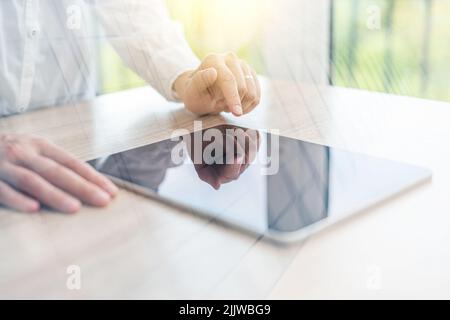 Engineer or businesswoman using tablet pc on the internet technology background. Stock Photo