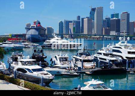 MIAMI, FL -18 MAY 2022- View of yachts in a marina with the downtown Miami skyline in the background. Stock Photo