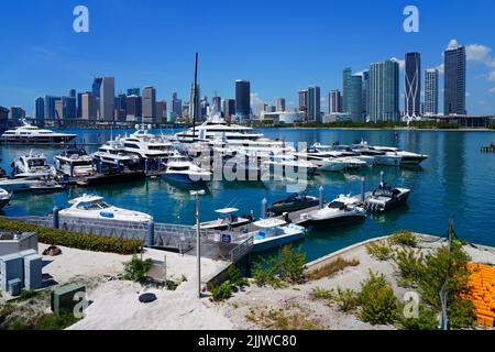 MIAMI, FL -18 MAY 2022- View of yachts in a marina with the downtown Miami skyline in the background. Stock Photo