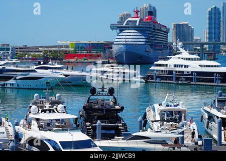 MIAMI, FL -18 MAY 2022- View of yachts in a marina with the downtown Miami skyline in the background. Stock Photo