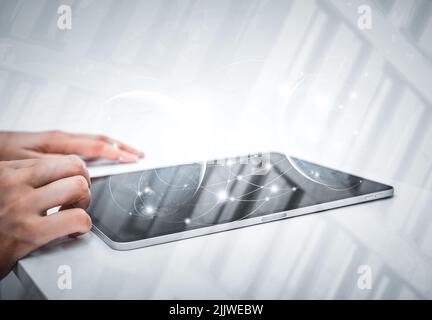 Engineer or businesswoman using tablet pc on the internet technology background. Stock Photo