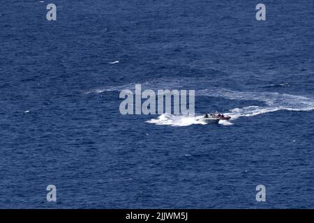 people having fun on banana boat in nice france Stock Photo