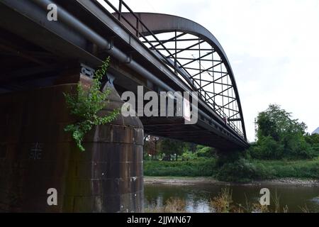 old railroad bridge built from stone and iron Stock Photo