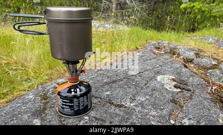 A metal container on small superfly burner in Whyte Lake Park Stock Photo
