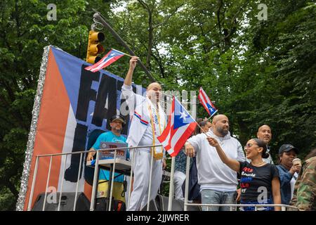 A large crowd of people coming out to celebrate the Puerto Rican Day Parade in New York City Stock Photo