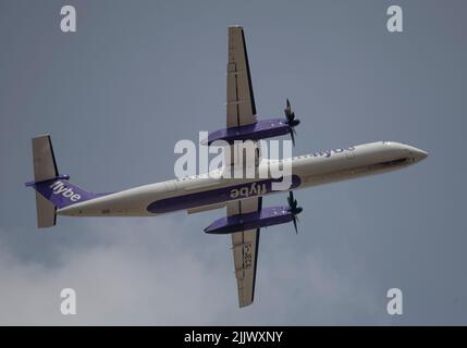 Heathrow Airport, London, UK. 28 July 2022. Flybe De Havilland Canada Dash 8 G-JECX flight taking off from Southern runway at Heathrow on London to Amsterdam route Stock Photo