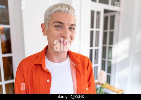 Portrait of young transgender man while looking at camera Stock Photo
