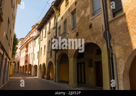 A quiet residential street with an arched portico in the historic centre of Treviso in Veneto, north east Italy Stock Photo