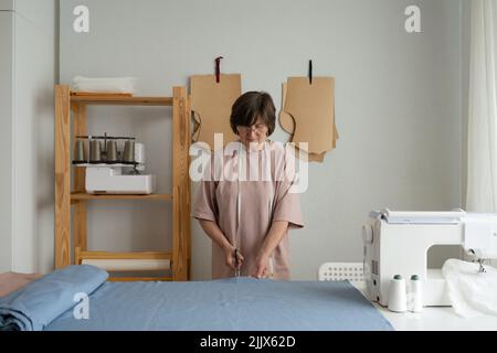 Concentrated Seamstress Putting Textile Table Measuring Tape Creation  Clothes Atelier Stock Photo by ©amixstudio 201120288