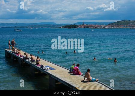 Izola, Sovenia - 10th July 2022. Locals and tourists enjoy the sun on the Adriatic coast of Slovenia near Izola Stock Photo