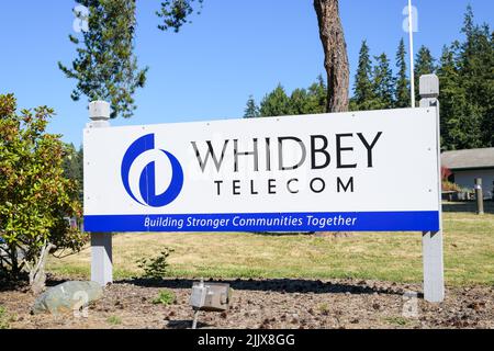Langley, WA, USA - July 26, 2022; Sign for Whidbey Telecom on Whidbey Island in Washington State Stock Photo