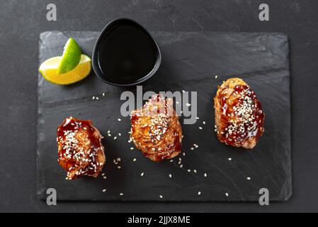Asian food. Fast food street food. Chicken in teriyaki sauce and sesame. a traditional Japanese way of frying using a common sweet sauce in Japanese Stock Photo