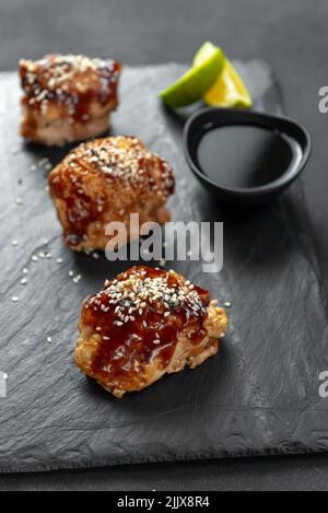 Asian food. Fast food street food. Chicken in teriyaki sauce and sesame. a traditional Japanese way of frying using a common sweet sauce in Japanese Stock Photo