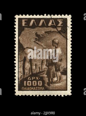 GREECE - CIRCA 1949: vintage canceled stamp printed in Greece shows kids near concentration camp, barbed wire, circa 1949. vintage postal stamp isolat Stock Photo