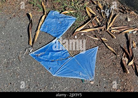 Broken blue kite on the floor, Rio Stock Photo