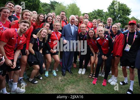 The Prince of Wales poses with athletes from Wales during a visit to the Athletes Village at the University of Birmingham at the Birmingham 2022 Commonwealth Games. Picture date: Thursday July 28, 2022. Stock Photo
