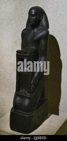 Statue of Djedhor. Greco-Roman period. Early Ptolemaic dynasty. Basalt, ca. 300-250 BC. Calouste Gulbenkian Museum. Lisbon, Portugal. Stock Photo