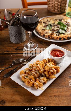 Popcorn shrimp appetizer with marinara sauce Stock Photo