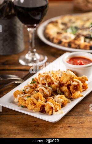 Popcorn shrimp appetizer with marinara sauce Stock Photo