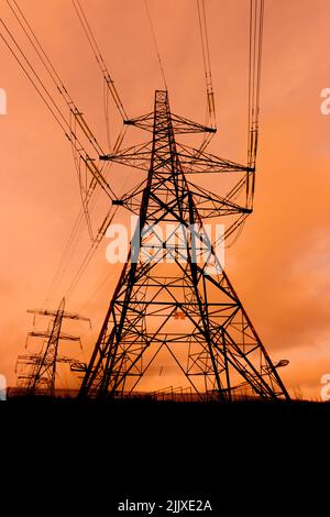 High voltage power pylon silhouette Stock Photo