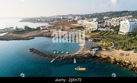 Aerial bird's eye view of Green bay in Protaras, Paralimni, Famagusta, Cyprus. The famous tourist attraction diving location rocky beach with boats, s Stock Photo