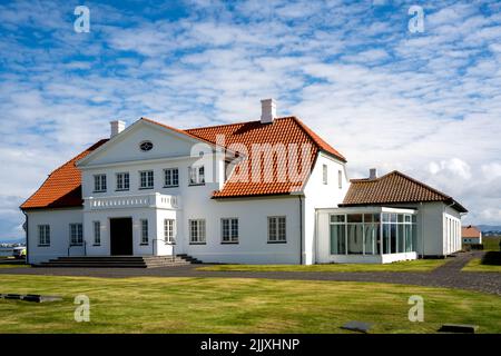 Álftanes, Iceland - July 1, 2022 View of the main building of the Bessastadir, a modest group of white, red-roofed buildings that is the official resi Stock Photo