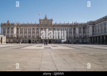 Madrid, Spain -- June 18, 2022. A wide angle photo looking over a courtyard of the Royal Palace and onto the palace itself. Stock Photo