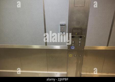 Close up interior view of modern elevator digital control panel. Stock Photo