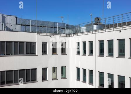 An office building with rooftop air conditioning system. Stock Photo