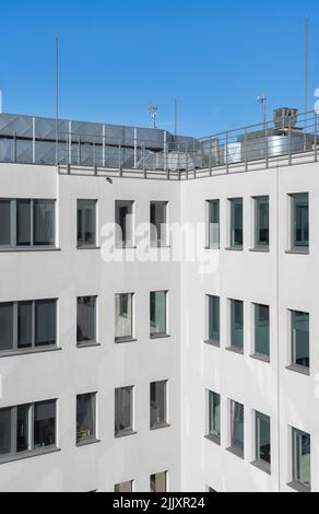 An office building with rooftop air conditioning system. Stock Photo