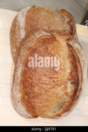 Two Loaves of Freshly Baked Crusty Bread. Stock Photo