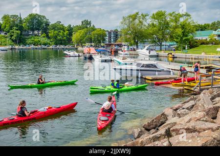 People kayak in downtown Gananoque, Ontario, Canada Stock Photo