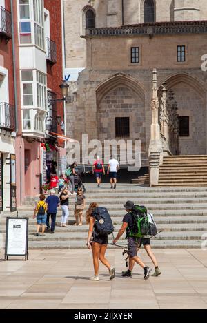 Pilgrims walking the Camino de Santiago, the way of St James entering , in the Spanish city of Burgos Spain Stock Photo