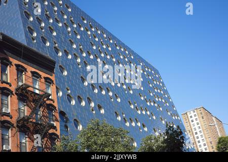 New York, NY, USA - July 27, 2022: The metallic outside with circular windows in the Dream Hotel in the Chelsea neighborhood of Manhattan Stock Photo
