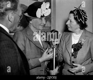 Arrived by ANA Skymaster from America. Miss Helen Keller famous American blind & deaf authoress who arrived to make an extensive tour of Australia speaks into the microphone on arrival. Her companion for 34 years Miss Polly Thompson (right) talks with her by meats of the hands. On the left is Mr Justice Maxwell, Press of the Sydney Industrial Blind Inst. is on the left. March 29, 1948. (Photo by Frederick John Halmarick/Fairfax Media). Stock Photo