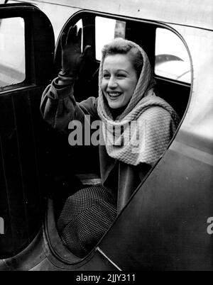 ry good-bye at a London airport as she leaves for Mont St. Michel, today (Mon.). Margaret Leighton, the film actress, has the chance of blazing into stardom in three major British films in the next few months, she has a big -part in Hitchcock's 'Under Capricorn,' was chosen out of 900 actresses to play Flora Macdonald in 'Bonnie Prince Charlie' with David Niven and now she has flow to France to-take the part of Lady Blakeney, opposite Niven, in the Archers film' The Elusive 'Pimpernel.' She is well known to playgoers at Birmingham Rep and the 'Old Vic.' October 4, 1948. (Photo by Reuterphoto). Stock Photo