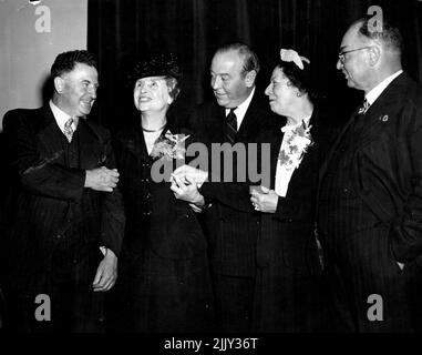 Miss Helen Keller visiting American blind and deaf authoress was given a civic reception by the Lord Mayor at the Town Hall today. Miss Keller being introduced to Lord Mayors from three different states. L to r. Ald Bartley Lord Mayor Sydney. Miss Helen Keller, Sir Raymond Connelly Lord Mayor Melbourne, Miss Polly Thompson, Mr John McLedy Lord Mayor Adelaide. March 31, 1948. (Photo by Ernest Charles Bowen/Fairfax Media). Stock Photo