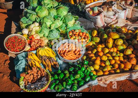 Fruit and vegetable market in Africa. Colorful healthy ingredients from the farm or from nature at the local market in Kenya. Bananas, mangoes, fruits Stock Photo