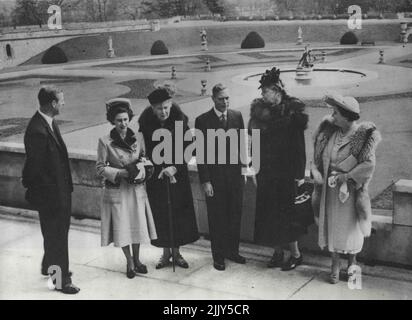 Mrs Roosevelt Is Guest Of King And Queen At Windsor Castle. Left to right: The Duke of Edinburgh; Princess Margaret; Queen Mary; the King; Mrs Eleanor Roosevelt; and Queen Elizabeth, photographed on the terrace at Windsor Castle. Princess Elizabeth, was also at the Castle, but was indisposed. Mrs Eleanor Roosevelt, who is to unveil a memorial statue to her late husband, the former President of the United Stares, Franklin D. Roosevelt, in Grosvenor Square on 12th April, was the guest of the Royal Family at Windsor Castle. April 4, 1948. Stock Photo