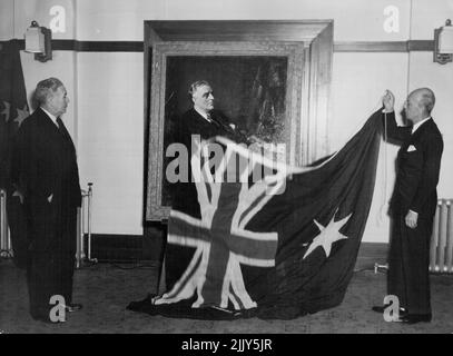 The U.S. Charge d'Affairs, Mr. Orsen Nielsen, unveils a portrait of the late Franklin Roosevelt at Parliament House, Canberra, in the presence of the Prime Minister, the Rt. Hon. J.B. Chifley. The portrait was painted by Franck Salisbury, R.I., and is a replica of one hanging at Hyde Park, New York State. It will from part of the Roosevelt Memorial library at Canberra. November 11, 1948. Stock Photo