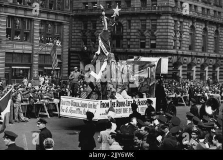 Italian Float In May Day Parade -- One of the many floats in the first May Day Parade in New York City since 1941 was this one representing Italy rising from the Ruins left by Fascism. It was estimated that more than 100,000 persons took part in the orderly parade down New York's eight avenue, May 1. May 1, 1946. (Photo by Associated Press Photo). Stock Photo