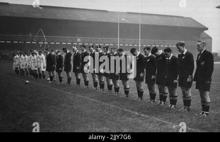 Rugby: New Zealand (All Blacks) Beat Combined Services By Twickenham. The teams and crowd stand in a Two Minute Silence remembering the victims of the terrible rail disaster in New Zealand. The New Zealand tourists defeated the Combined Services by 40 points to 8 in their Boxing Day match on the famous Twickenham ground, near London. December 26, 1953. (Photo by Sport & General Press Agency, Limited). Stock Photo