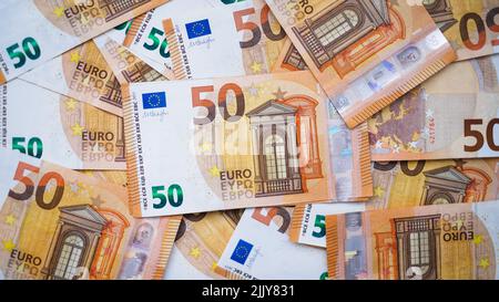 The background consists of many euro banknotes of different denominations. Finance and business concept Stock Photo