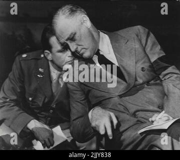 President Roosevelt Talks With His Son At Casablanca. President Franklin D. Roosevelt talks with his son, Lt. Col. Elliott Roosevelt, during the historic Allied conference at Casablanca. Lt, Col, Roosevelt is attached to a photographic unit of the U.S. Army Air Forces operating in North Africa. March 29, 1943. (Photo by Interphoto News Pictures, Inc.). Stock Photo