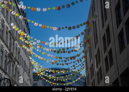 A street decorated with garlands in downtown Hamburg Stock Photo