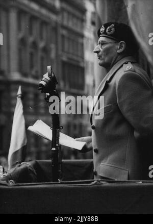 s recruiting speech at the Mansion House, London, to-day (Wed). Before the streets were closed to traffic large crowds began to assemble outside the mansion house to-day (Wed) for Field Marshal Viscount ***** speech in connection with the Territorial Army Recruiting campaign. The crowd took up positions on traffic Islands and street corners and some found ledges in the Bank of England and other buildings to met a better view. Police were again out in force, but there were no disturbances like there which had marked the two previous recruiting meetings. October 06, 1948. (Photo by Reuterphoto). Stock Photo