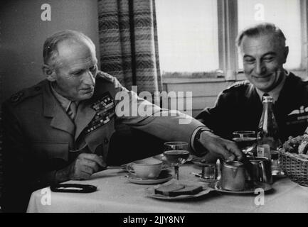 Field Marshal Montgomery -- The Field Marshal takes no precedence when it comes to meals. He dines just like any other officer junior or otherwise in the officers mess at H.Q. Invariably he invites one of his staff to lunch with him and the conversation is for the most part about work. Here he is seen lunching in the officers mess at H.Q. with Air Marshal Sir Walter Dawson. January 10, 1955. Stock Photo