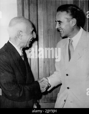 Mossadeq Shakes Hands With Truman's Rep -- Premier Mossadeq of Persia shakes hands with Mr. W. Averell Harriman, special representative of the president of the United States, soon after the latter's arrival for talks on the oil crisis. July 18, 1951. (Photo by Associated Press Photo). Stock Photo