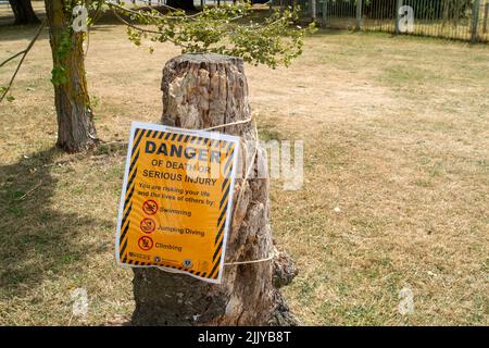 Windsor, Berkshire, UK. 28th July, 2022. Following the body of a man being recovered from the River Thames near Baths Island in Windsor last week, new danger signs have been put up next to the River Thames warning people of the dangers of swimming and diving into the River Thames. Credit: Maureen McLean/Alamy Live News Stock Photo